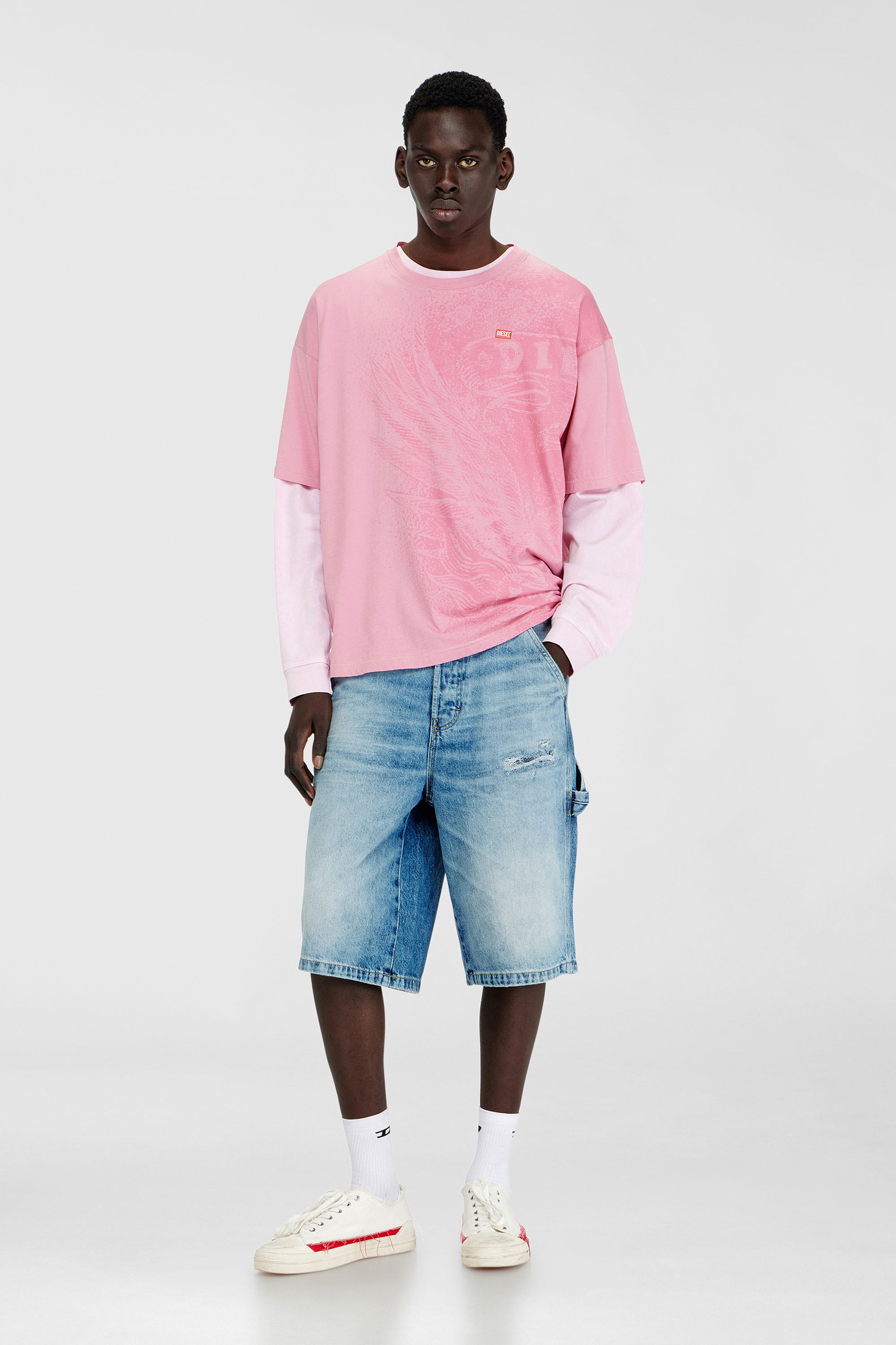 Relaxed shorts in fluid denim with abrasions